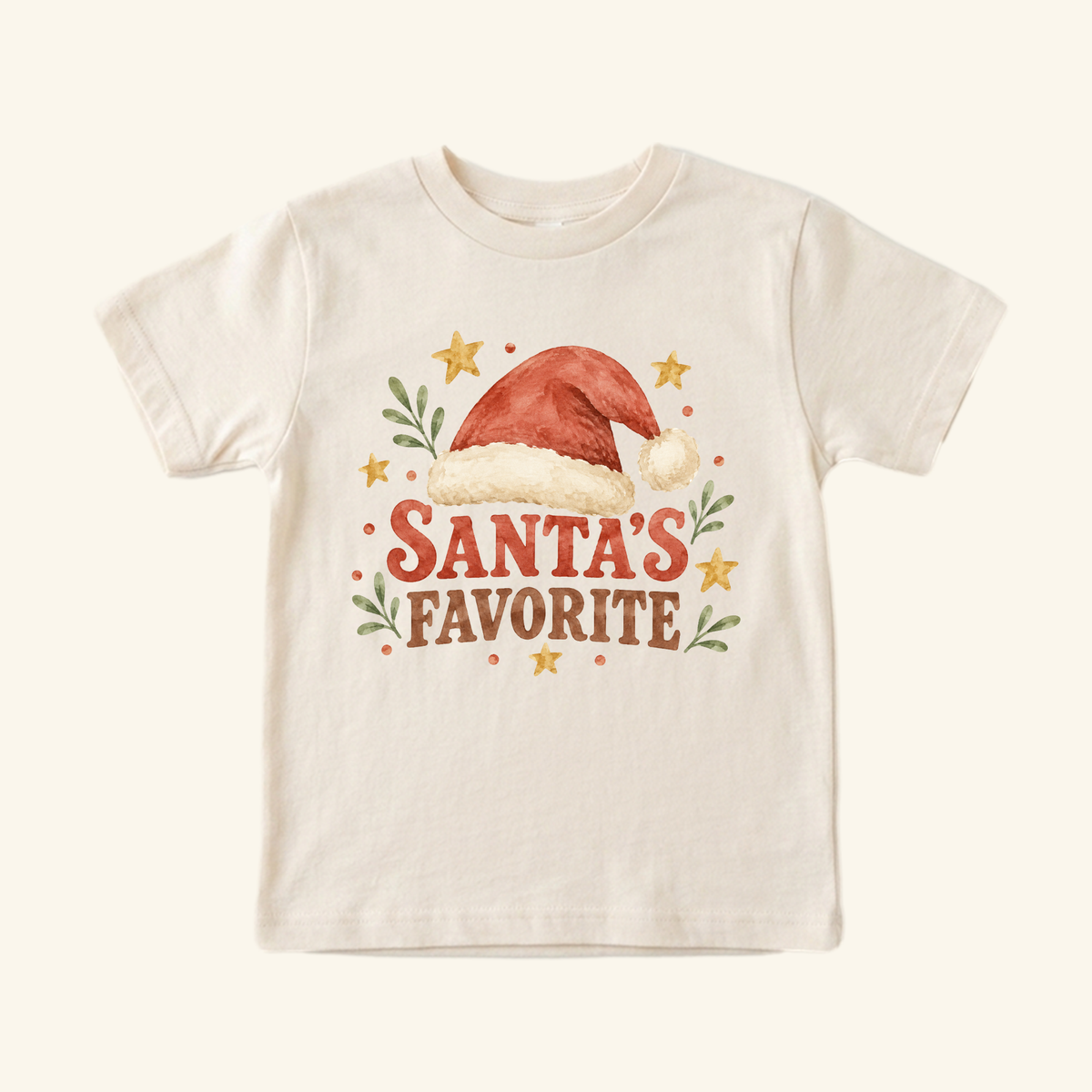 Cream-colored Santa’s Favorite Toddler Shirt – Retro Christmas Santa Hat Tee featuring a watercolor illustration of a Santa hat above the text SANTAS FAVORITE, surrounded by small stars and leaves.