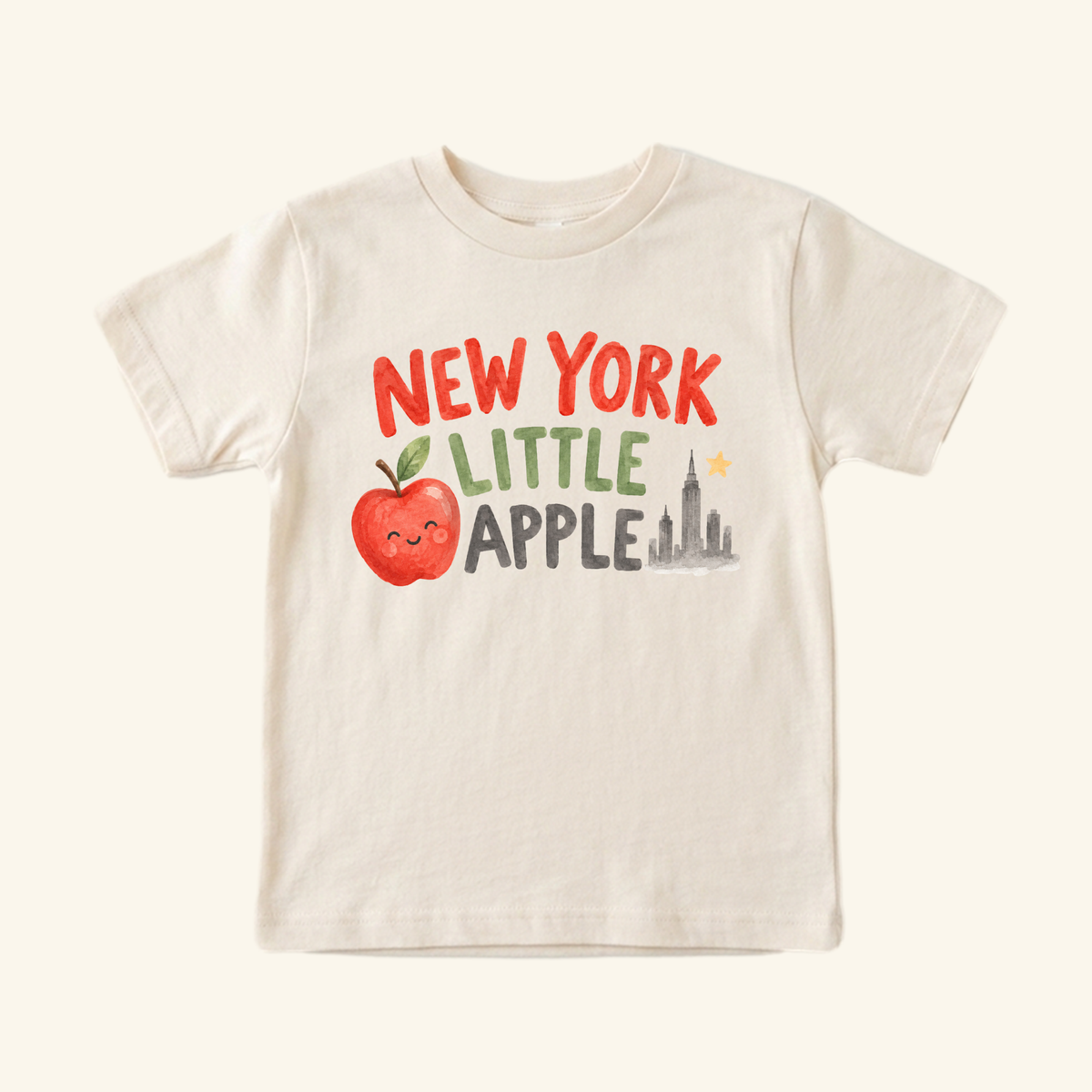 New York Toddler Shirt – Little Apple Skyline Watercolor Tee featuring a watercolor graphic of a smiling apple, a New York City skyline, and the text NEW YORK LITTLE APPLE.