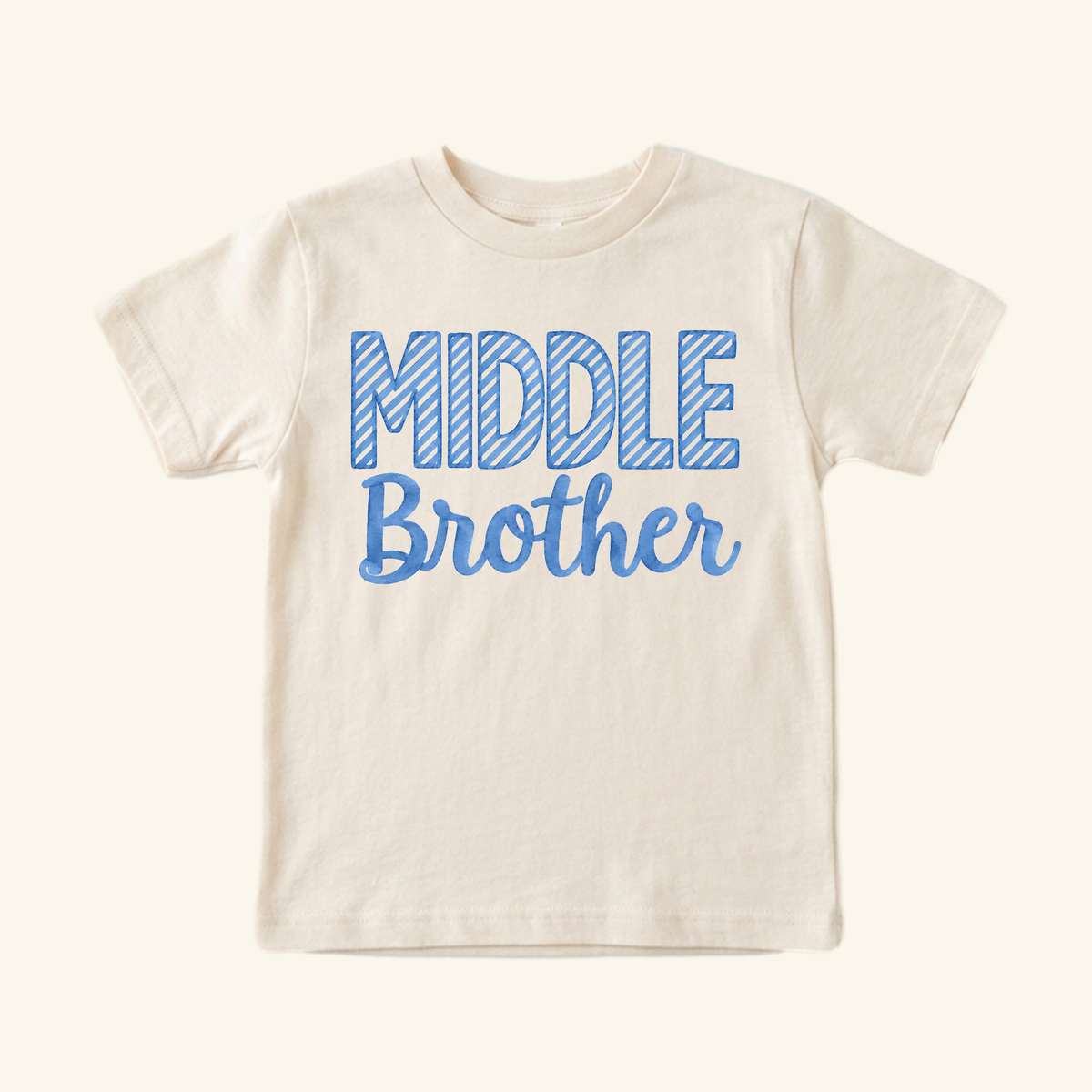 Middle Brother Toddler Shirt – Blue Striped Letters Sibling Tee in cream, featuring MIDDLE in blue striped block letters with Brother in blue script underneath.