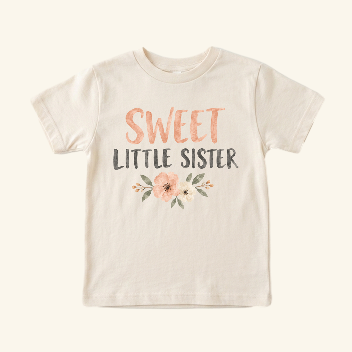 Sweet Little Sister Toddler Shirt – Floral Sibling Tee in cream featuring the text SWEET LITTLE SISTER in coral and dark gray, accented by a floral illustration below the lettering.