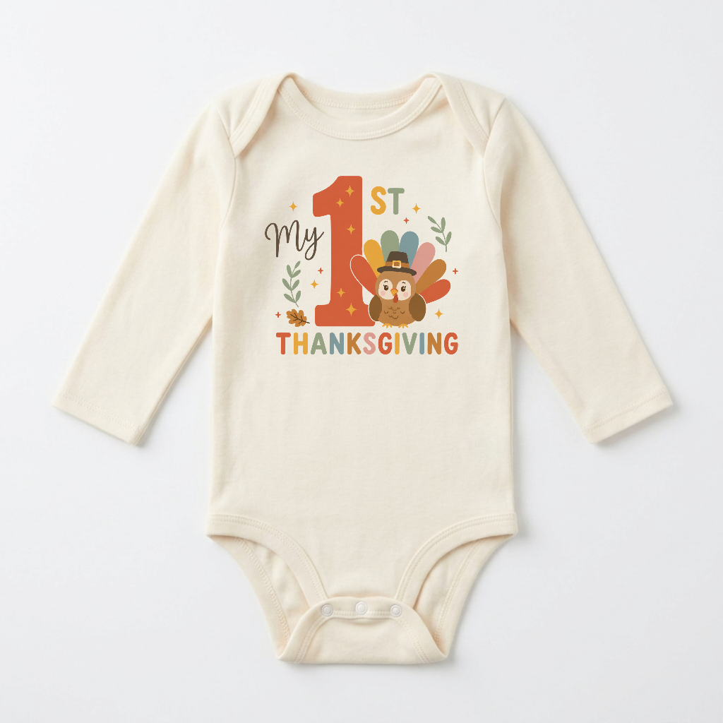 Dress your little one in the Toodleroos Long-Sleeve Baby’s First Thanksgiving Onesie – My 1st Thanksgiving Turkey: a cream-colored outfit featuring “My 1st Thanksgiving” text and an adorable turkey in a pilgrim hat, surrounded by leaves and stars—the perfect choice for your baby’s first Thanksgiving celebration.