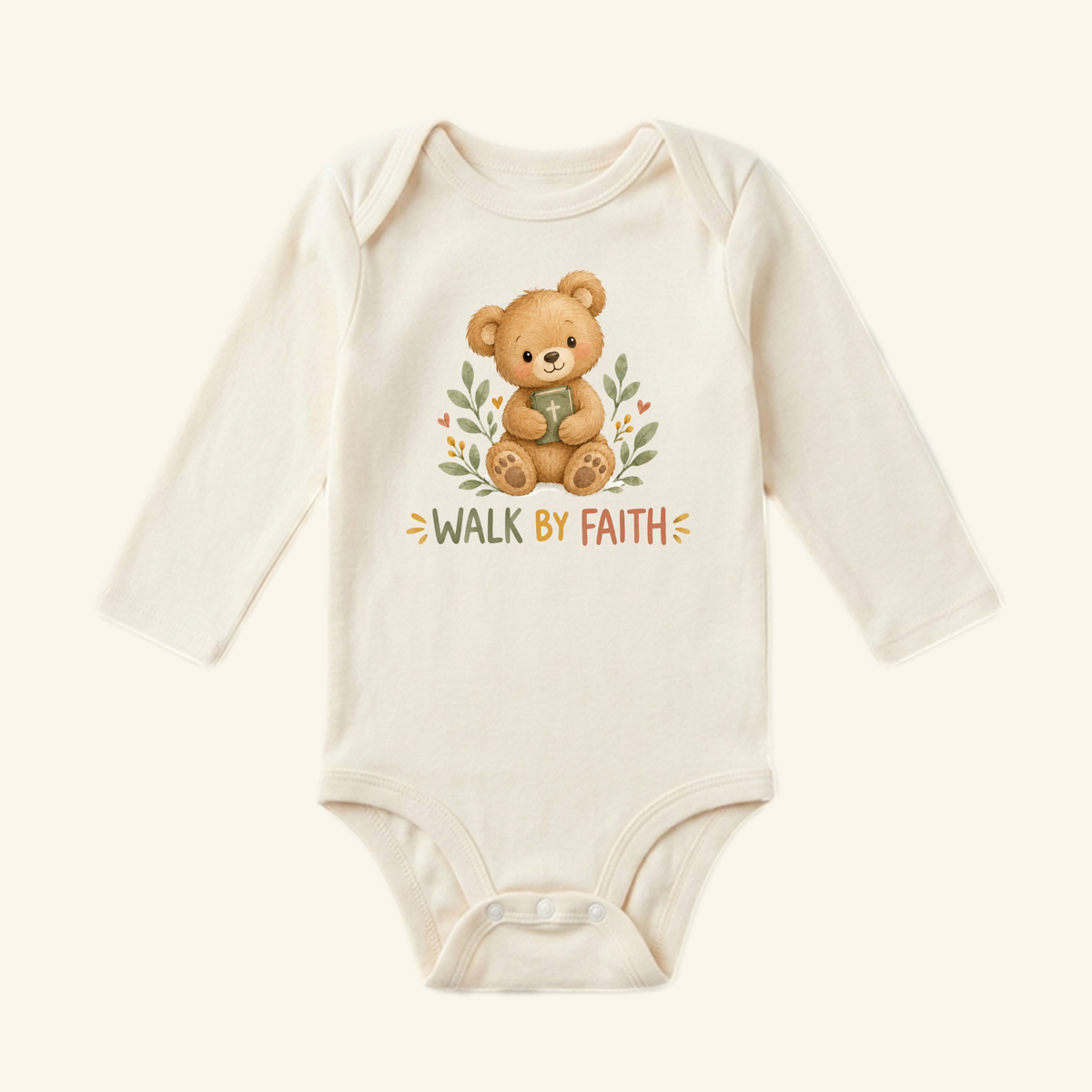 The Toodleroos Christian Baby Onesie – Walk by Faith Bear Bodysuit is a cream, long-sleeve bodysuit with a smiling bear and leaf design—an adorable Christian baby gift.