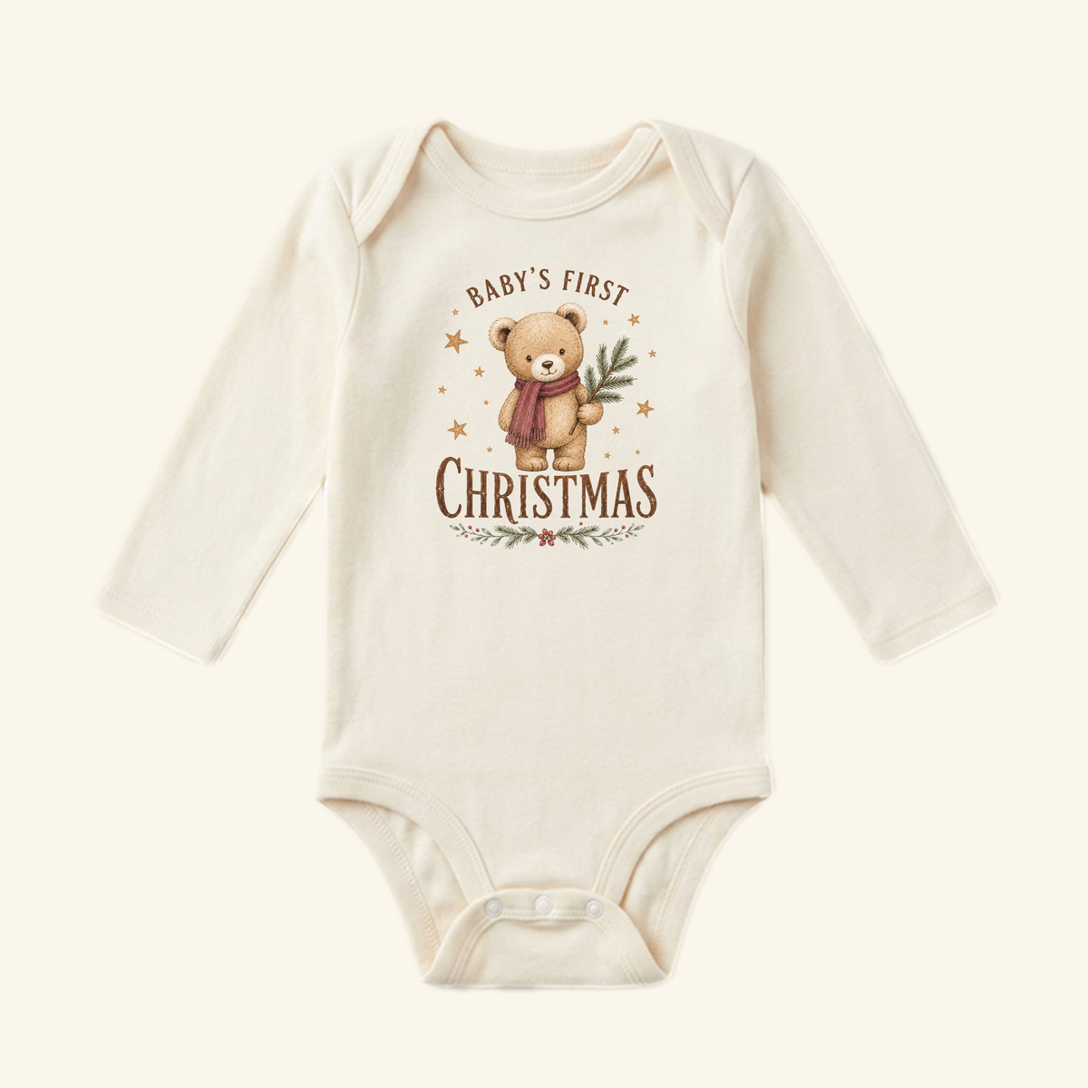 Toodleroos Baby’s First Christmas Baby Onesie – Teddy Bear Christmas Bodysuit, a long-sleeve bodysuit featuring a teddy bear wearing a scarf and holding a pine branch.