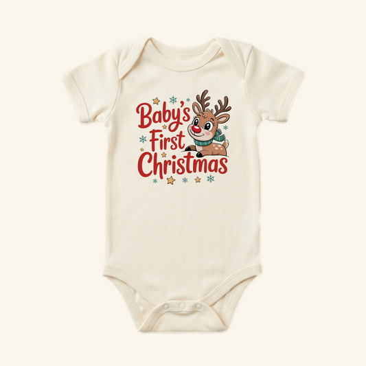 Toodleroos Baby’s First Christmas Baby Onesie – Reindeer Holiday Bodysuit in cream, featuring a cartoon reindeer and the text Baby’s First Christmas 2026 in red and blue.