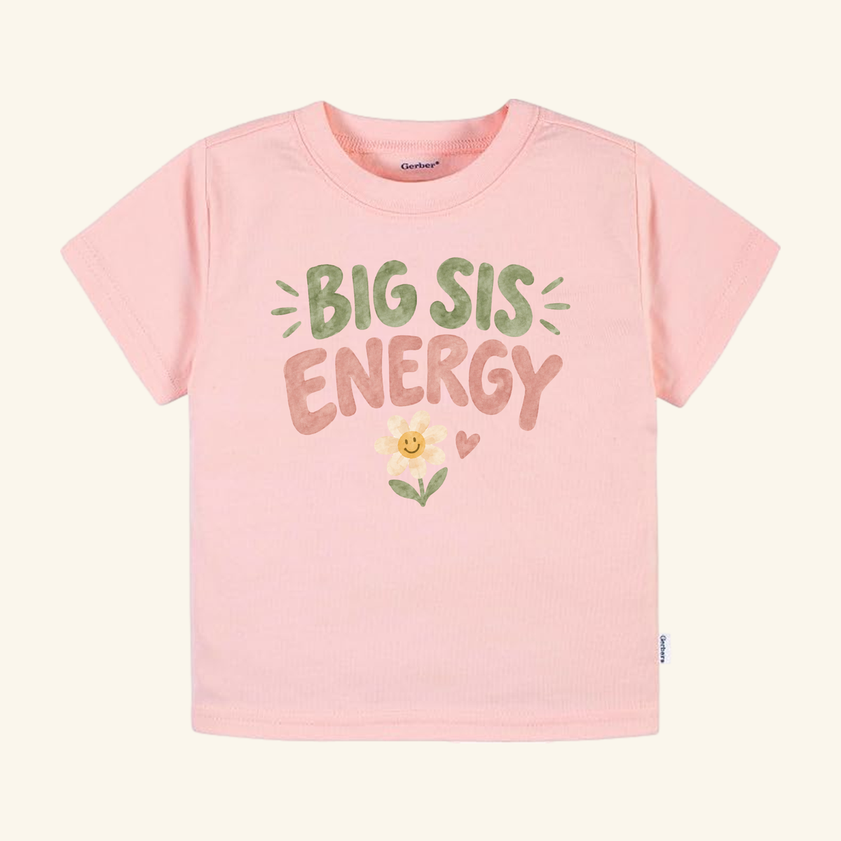 Light pink Big Sis Energy Toddler Shirt – Smiley Daisy Sibling Tee with BIG SIS ENERGY text in green and brown, accented by a small smiley daisy and a heart.