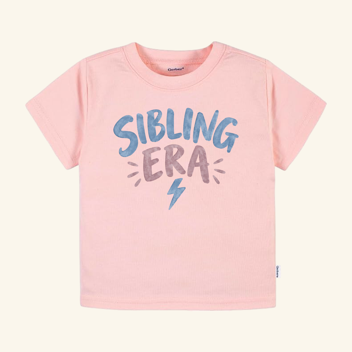 Light pink Sibling Era Toddler Shirt – Lightning Bolt Sibling Tee featuring a blue and purple lightning bolt graphic.