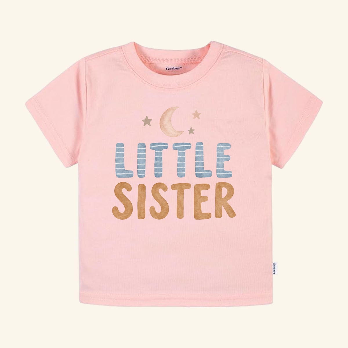 Light pink Little Sister Toddler Shirt – Moon and Stars Sibling Tee featuring a crescent moon and stars graphic above the text.