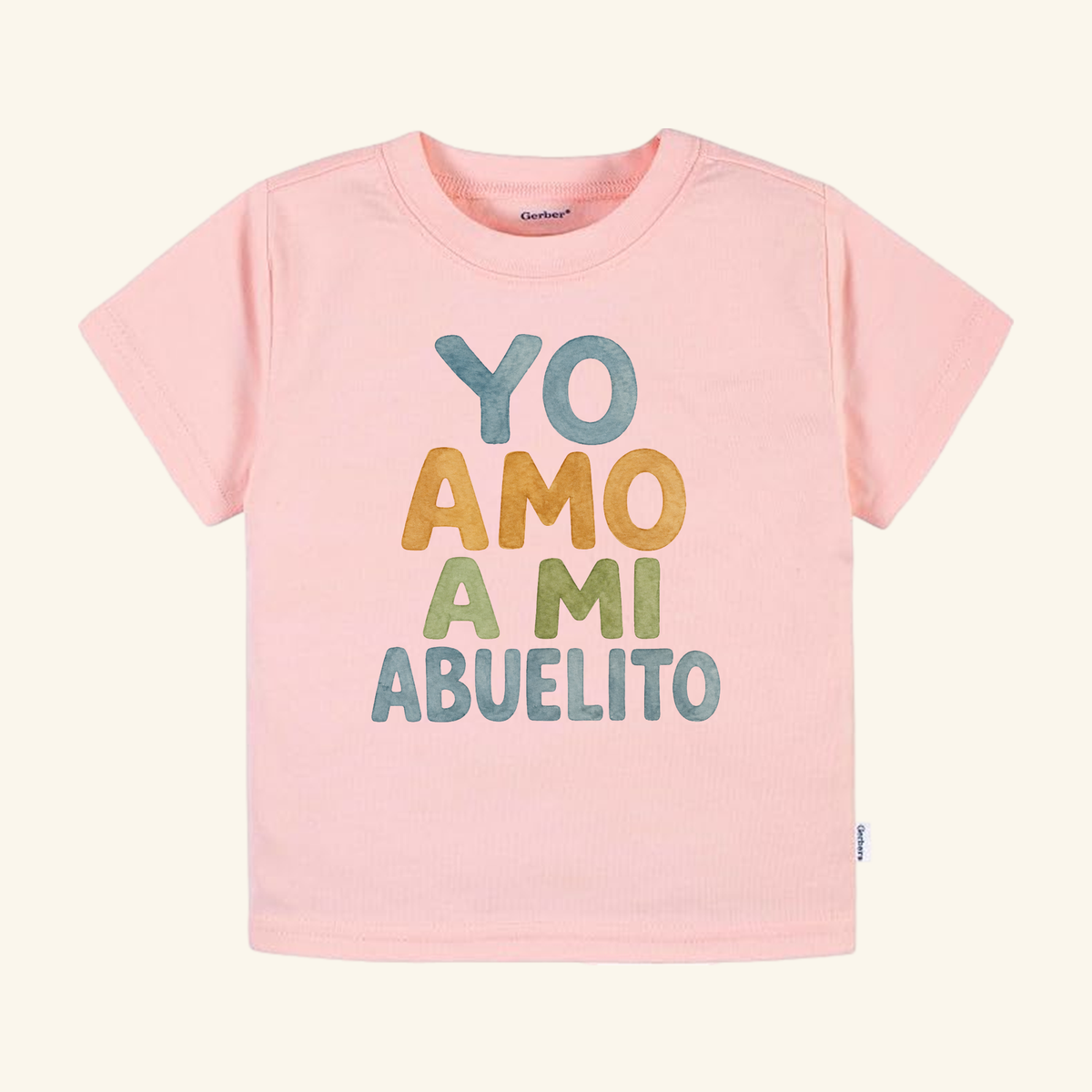 Light pink Yo Amo A Mi Abuelito Toddler Shirt featuring multicolored, textured lettering.