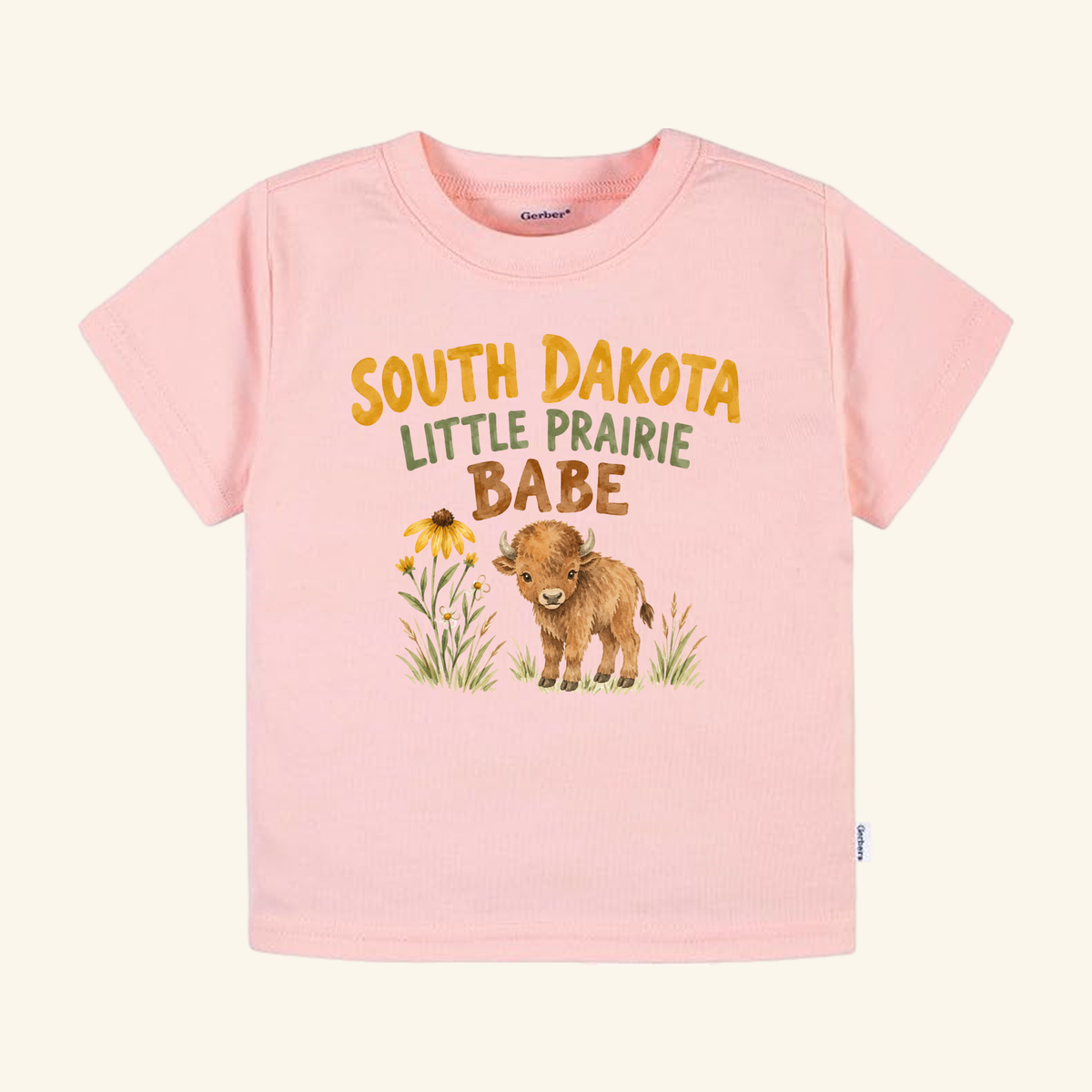 Light pink Toodleroos South Dakota Toddler Shirt – Little Prairie Babe Buffalo Tee featuring a buffalo calf and wildflowers with the text South Dakota Little Prairie Babe.