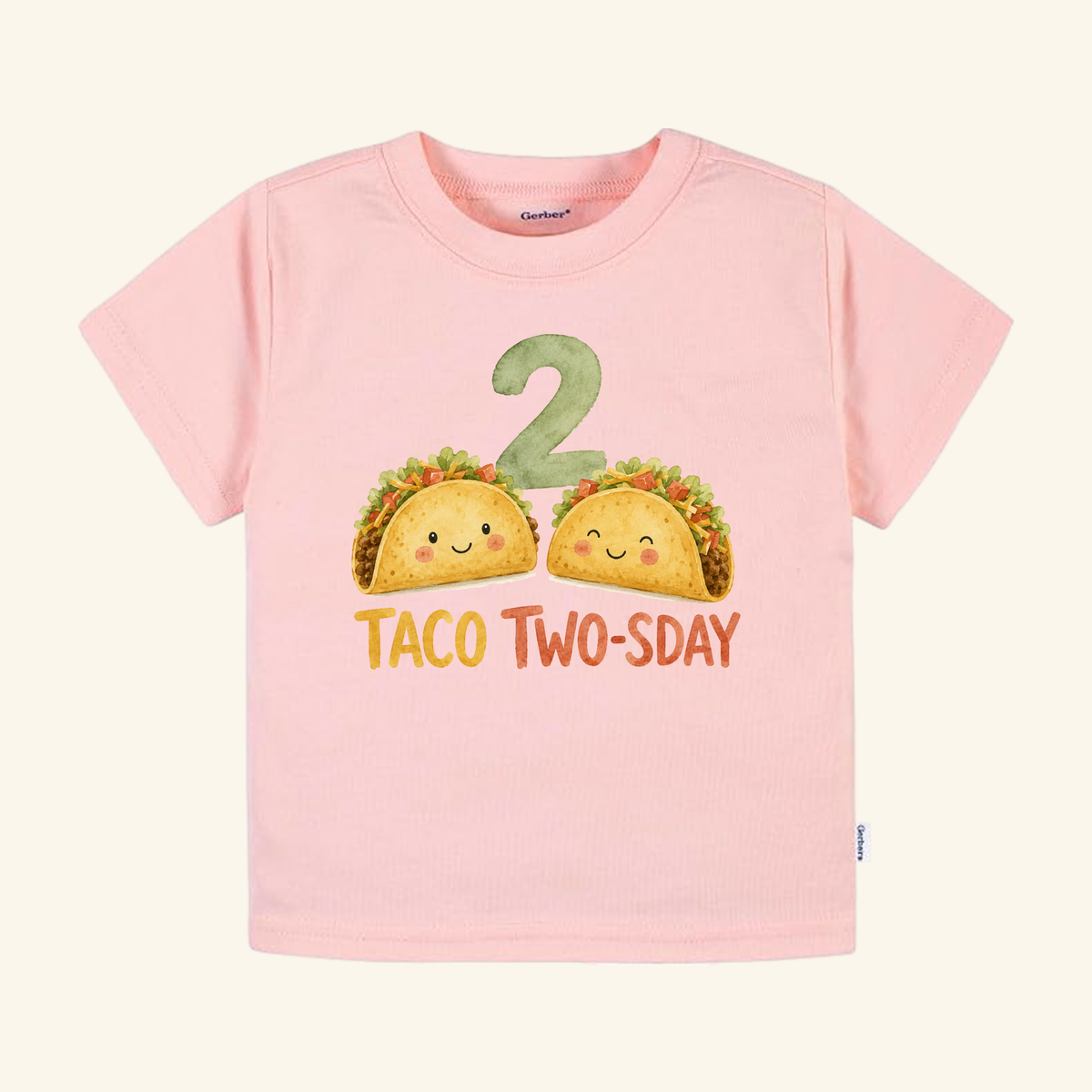 Light pink Toodleroos Taco Two-sday 2nd Birthday Toddler Shirt featuring two smiling tacos and a large green number 2.