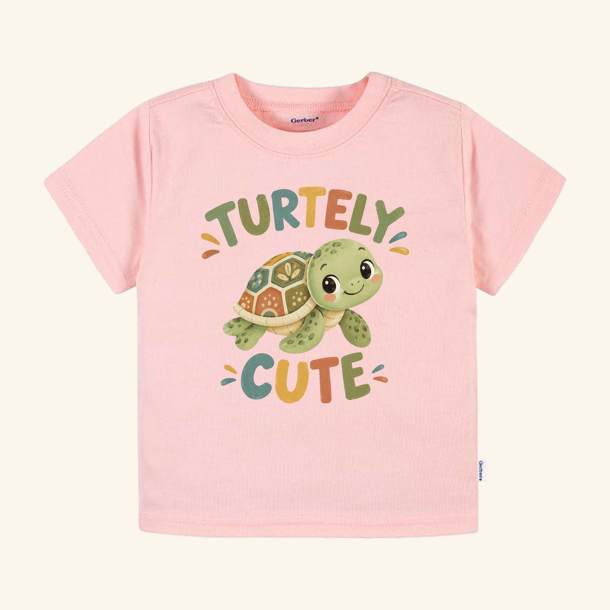 Pink short-sleeve Turtley Cute Toddler Shirt – Watercolor Turtle Short-Sleeve Tee featuring a watercolor illustration of a smiling turtle and the text TURTELY CUTE.