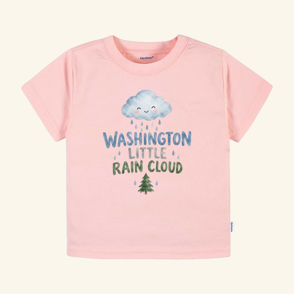 Light pink Washington Toddler Shirt – Little Rain Cloud Pacific Northwest Tee featuring a smiling rain cloud above the text WASHINGTON LITTLE RAIN CLOUD and a small evergreen tree.