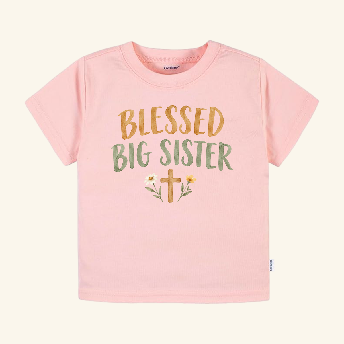 Light pink Blessed Big Sister Toddler Shirt – Christian Floral Cross Tee featuring a floral cross and the text BLESSED BIG SISTER in brown and green for a Christian sibling announcement.