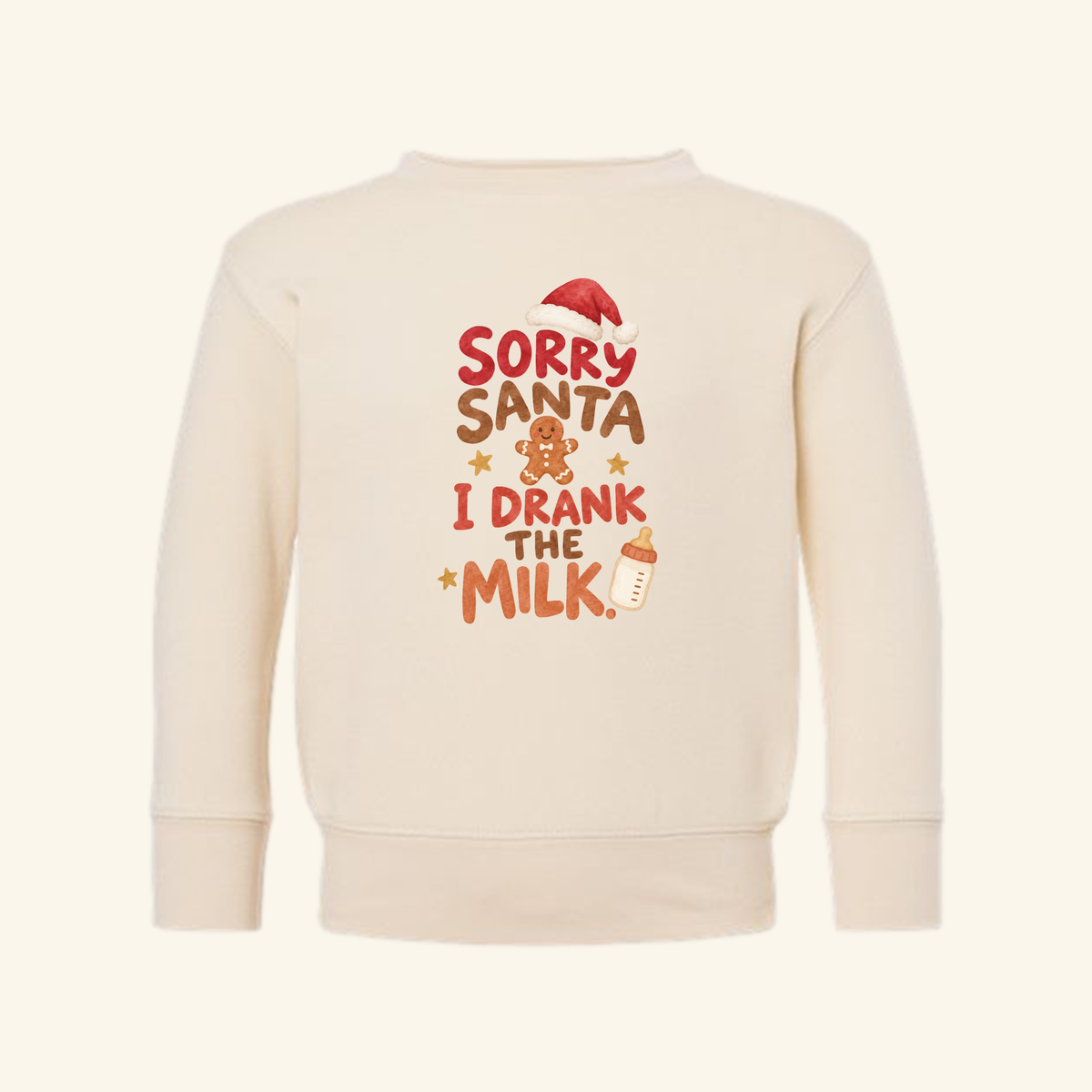 Cream-colored Toodleroos Sorry Santa I Drank the Milk Toddler Sweatshirt featuring a gingerbread man, a Santa hat, and a baby bottle.