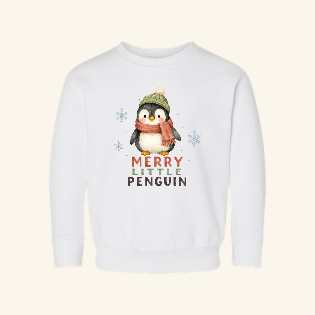 Merry Little Penguin Toddler Sweatshirt – Cute Christmas Pullover featuring a white toddler sweatshirt with an illustration of a penguin in a knit hat and scarf, text reading MERRY LITTLE PENGUIN, and small snowflakes.