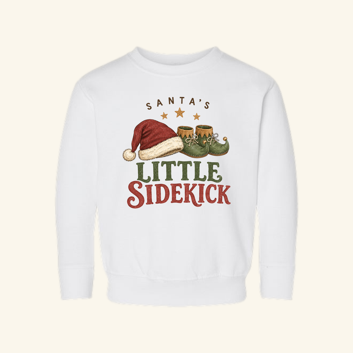 White long-sleeve Santa’s Little Sidekick Toddler Sweatshirt – Christmas Elf Pullover featuring a graphic of a Santa hat and elf shoes.