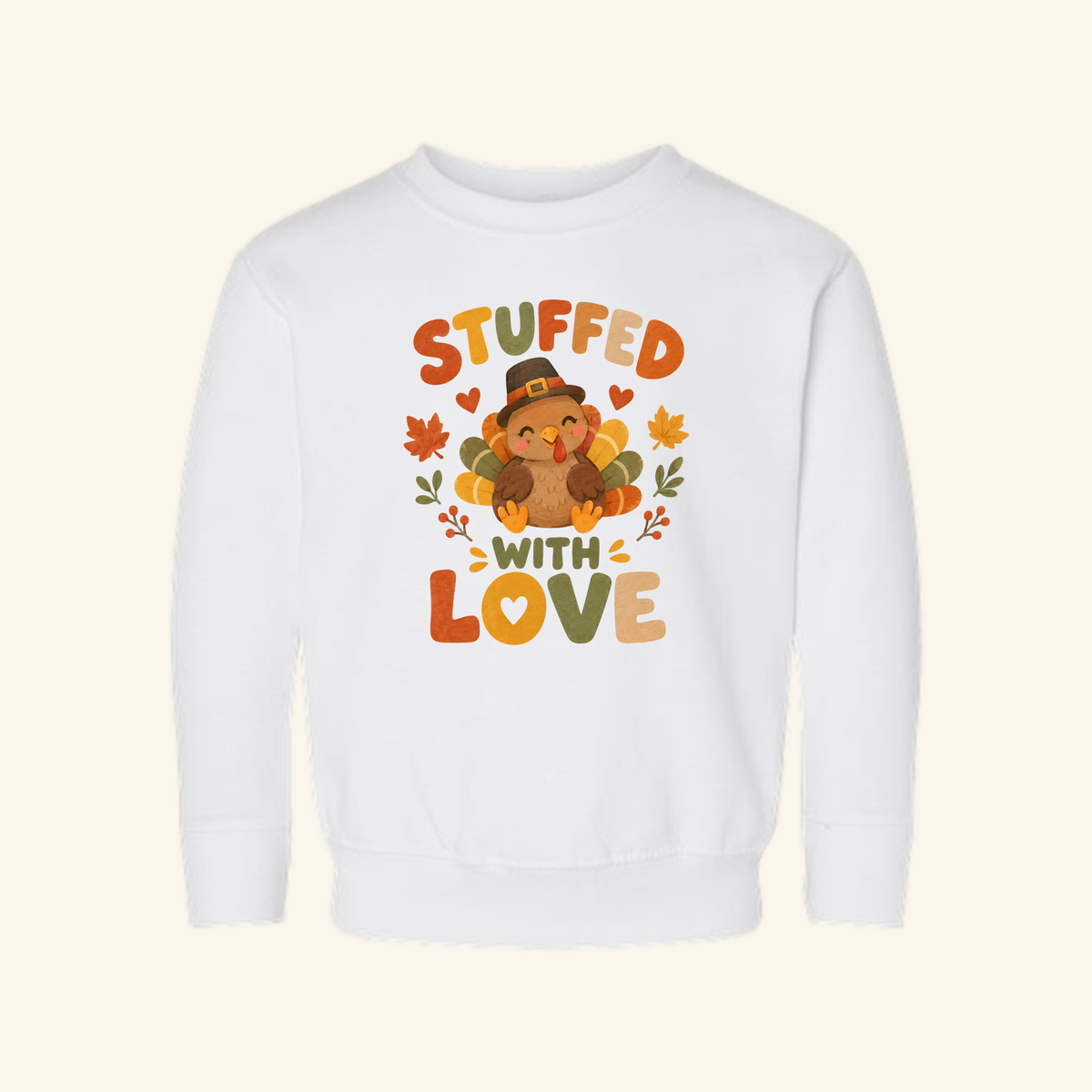 Toodleroos Stuffed With Love Toddler Sweatshirt – Thanksgiving Turkey Pullover featuring a cartoon turkey in a pilgrim hat, surrounded by autumn leaves and the text STUFFED WITH LOVE.