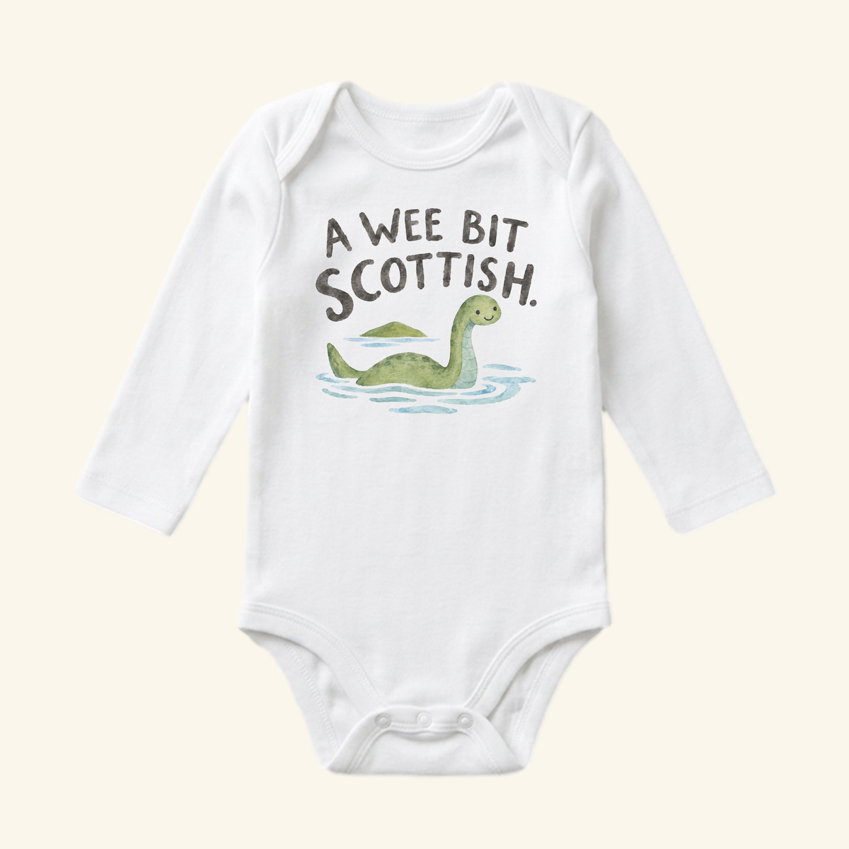 A Wee Bit Scottish Baby Onesie featuring a white long-sleeve bodysuit with a watercolor illustration of the Loch Ness monster and the text A WEE BIT SCOTTISH.