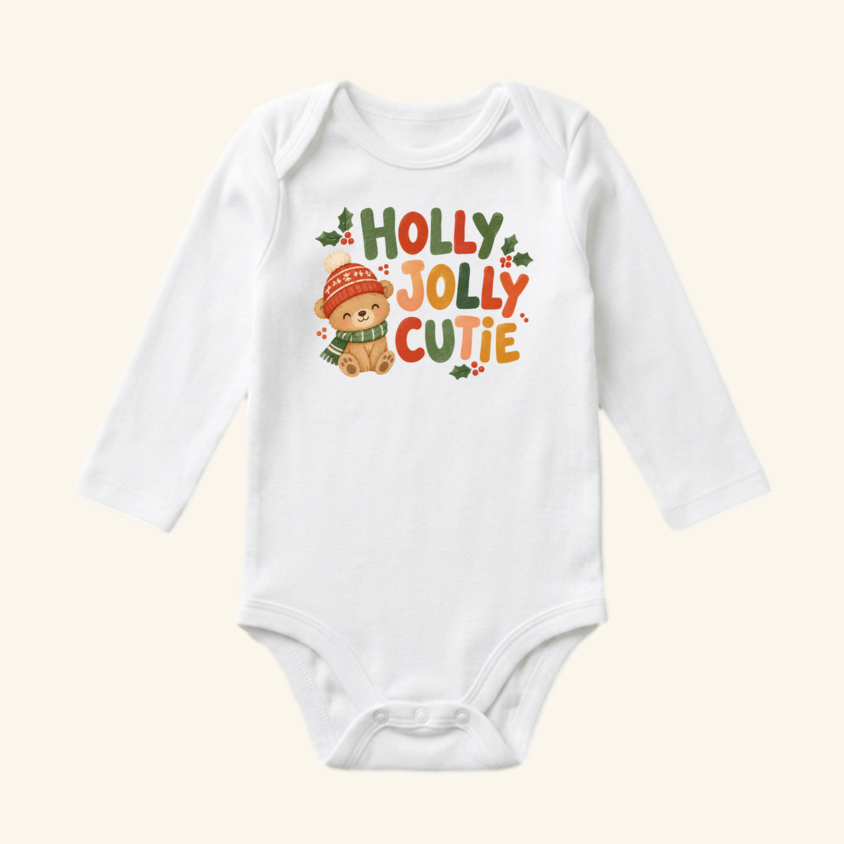 Toodleroos Holly Jolly Cutie Baby Onesie – Cute Teddy Bear Christmas Bodysuit featuring a white long-sleeve bodysuit with a teddy bear in a winter hat and scarf, text reading Holly Jolly Cutie, and holly leaf accents.
