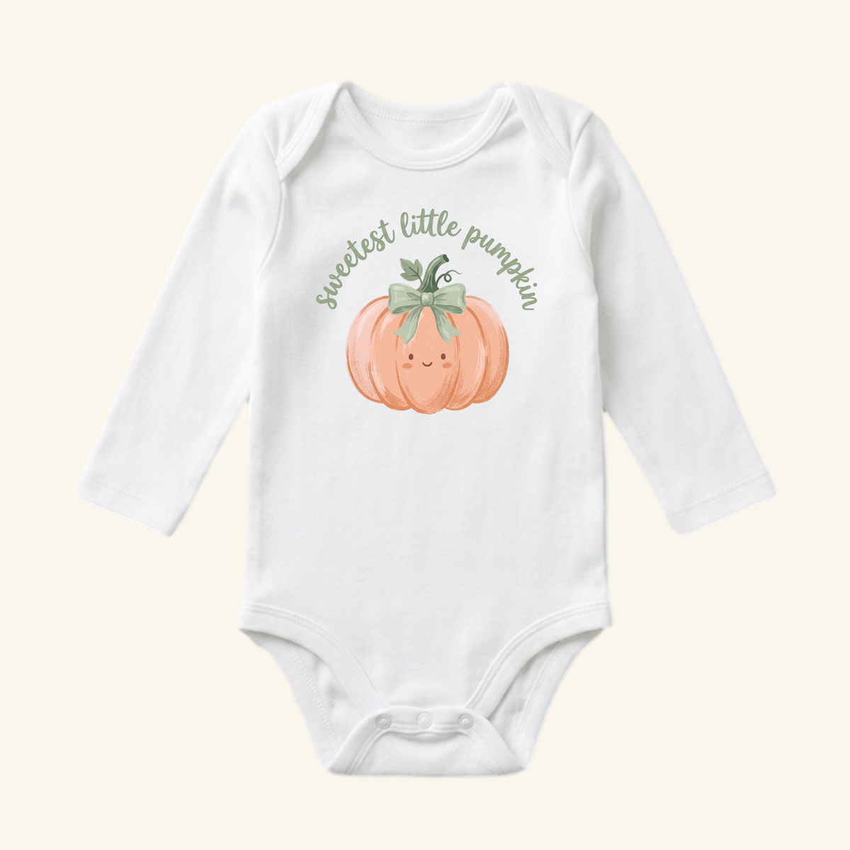 Toodleroos Sweetest Little Pumpkin Baby Onesie – Fall Pumpkin Bow Bodysuit, featuring a white long-sleeve bodysuit with a smiling orange pumpkin with a green bow and the text sweetest little pumpkin arched above it.