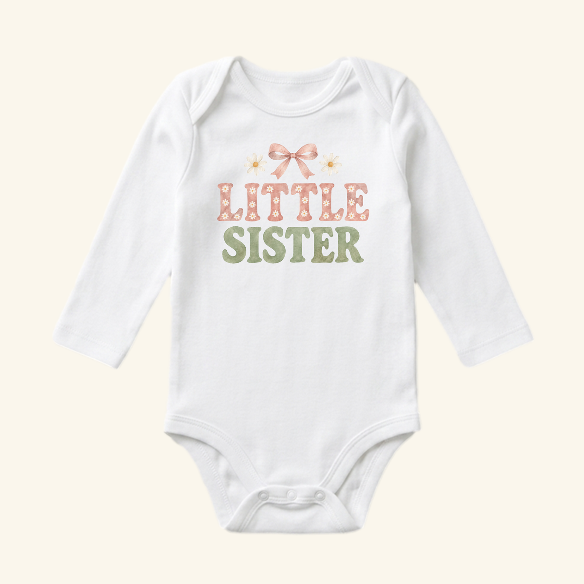Toodleroos Little Sister Baby Onesie – Daisy Bow Sibling Bodysuit in white with long sleeves, featuring a pink bow, two daisies, and the text LITTLE SISTER in pink and green.