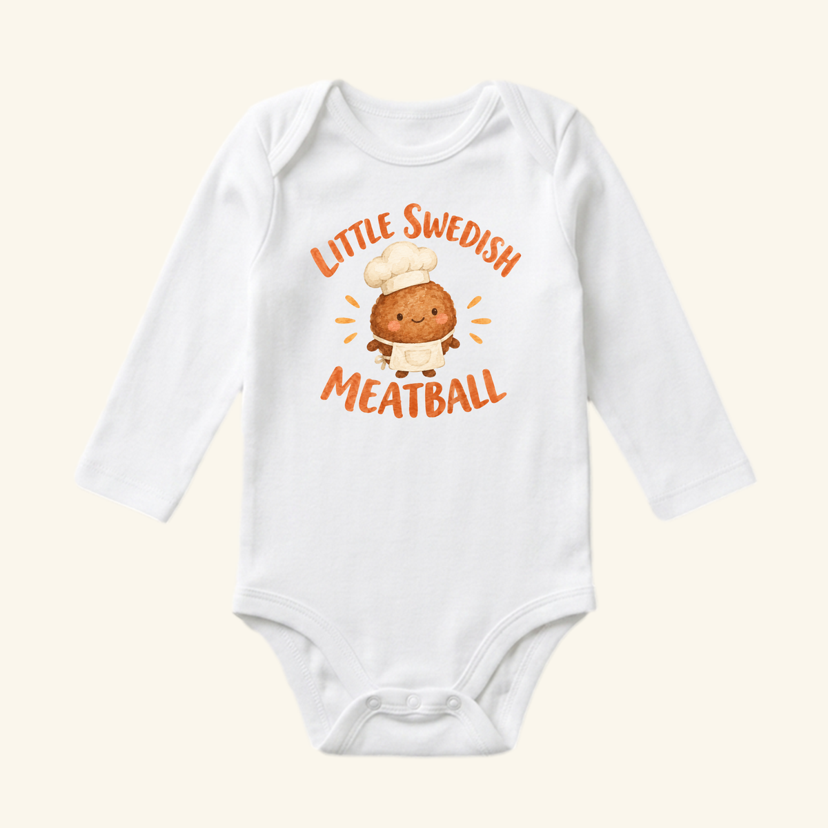 Toodleroos Little Swedish Meatball Baby Onesie – Cute Chef Bodysuit, featuring a white long-sleeve design with a cartoon meatball in a chef’s hat and apron, and text reading Little Swedish Meatball above and below.