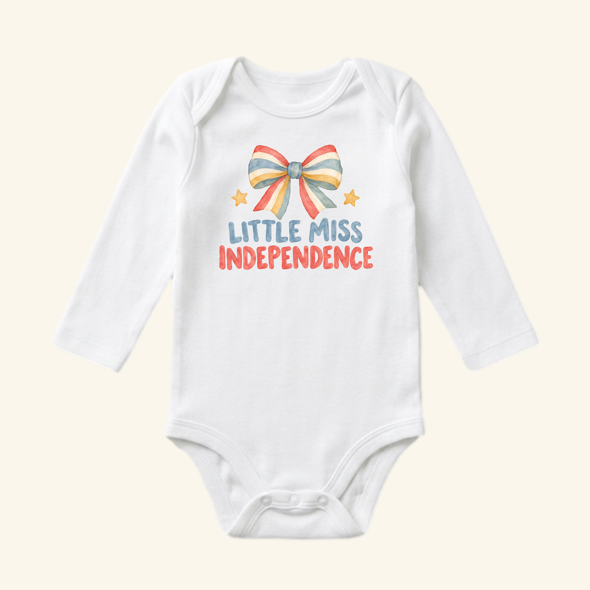 Little Miss Independence Baby Onesie – Patriotic Bow Bodysuit featuring a long-sleeved white design with a red, white, and blue watercolor bow, two small stars, and the text Little Miss Independence.