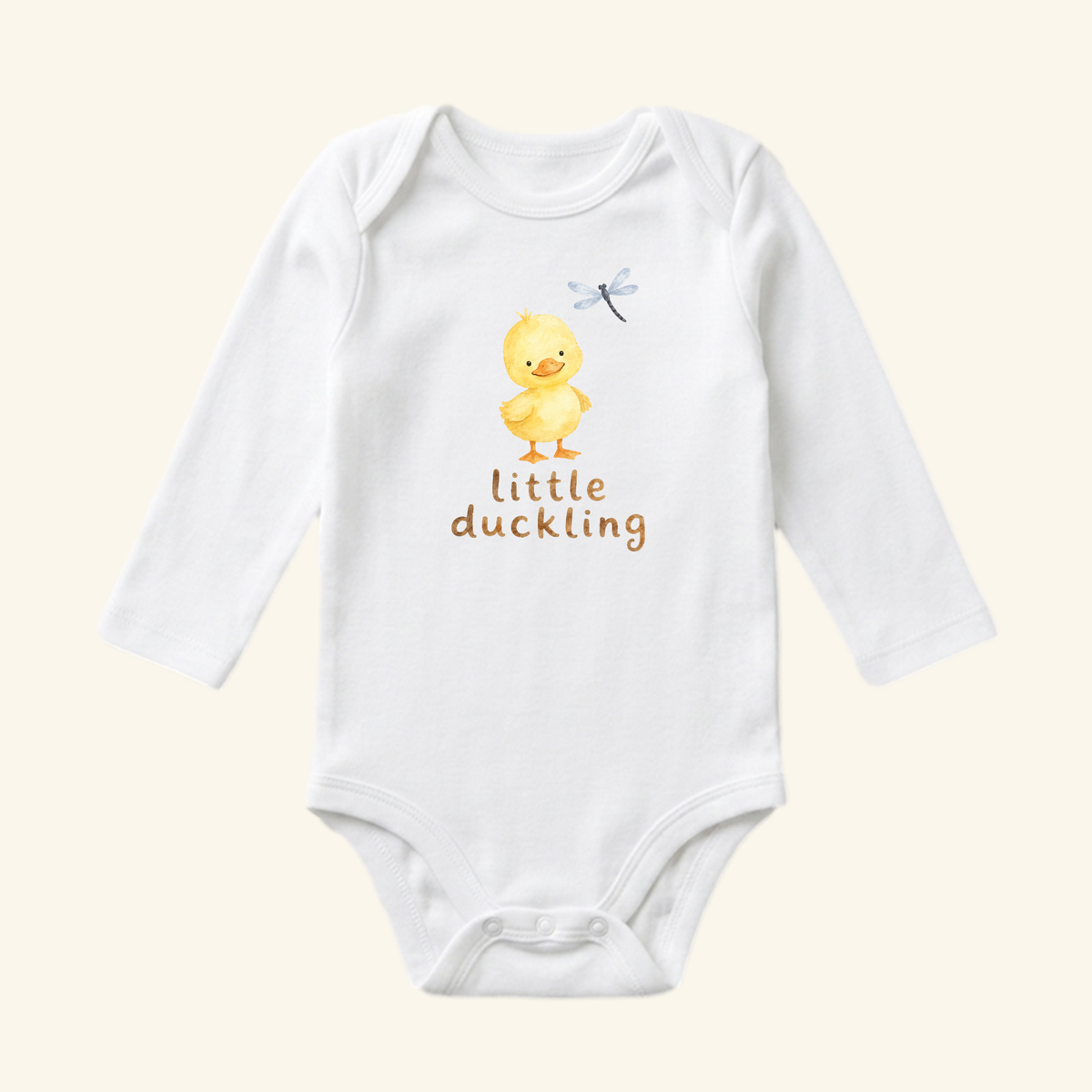 Little Duckling Baby Onesie – Cute Watercolor Duck Bodysuit featuring a white long-sleeve onesie with a watercolor illustration of a yellow duckling and a dragonfly, with the text little duckling printed below.
