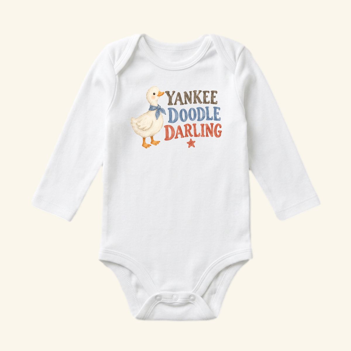 White long-sleeve Yankee Doodle Darling Baby Onesie – Patriotic Duckling Bodysuit featuring a drawing of a duckling wearing a blue scarf, the text, and a small star.