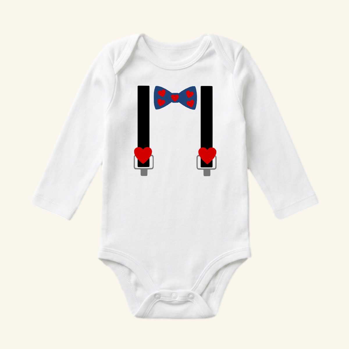 Toodleroos Valentine’s Day Baby Onesie – Heart Bow Tie & Suspenders Bodysuit featuring a white long-sleeve design with black suspenders, a blue bow tie with red hearts, and red heart accents.