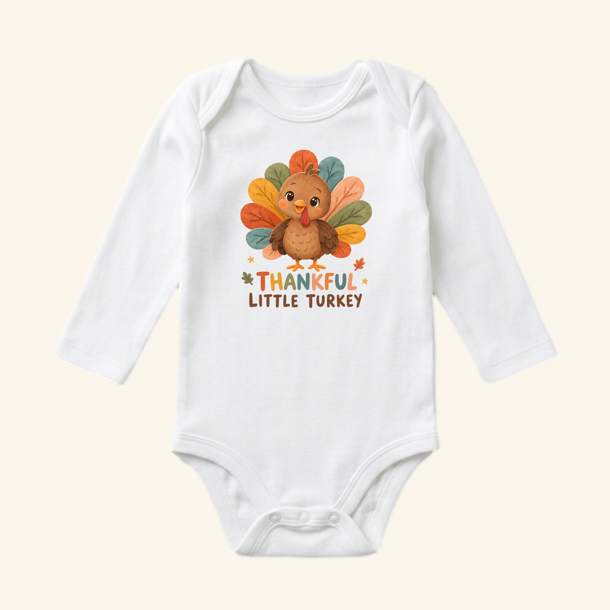 Toodleroos Thankful Little Turkey Baby Onesie – Thanksgiving Bodysuit featuring a white long-sleeve design with a cartoon turkey with colorful feathers and the text THANKFUL LITTLE TURKEY.