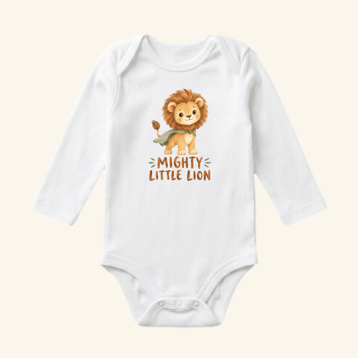 Toodleroos Mighty Little Lion Baby Onesie, a white long-sleeve bodysuit featuring an illustration of a lion cub wearing a green cape with the text Mighty Little Lion below it.