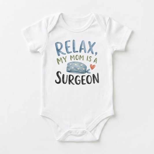 Dress your little one in the Toodleroos Surgeon Mom Baby Onesie – My Mom Is a Surgeon Short-Sleeve Bodysuit, featuring the playful text “RELAX, MY MOM IS A SURGEON” and an illustration of a blue surgical cap with a cute red heart. This adorable medical-themed bodysuit is the perfect gift for any new surgeon mom welcoming her baby.