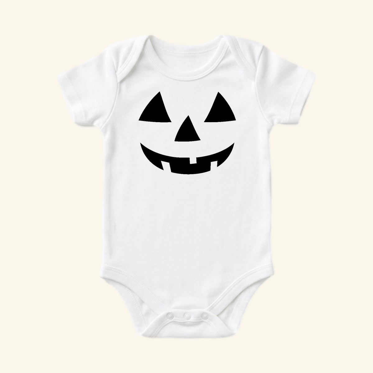 Toodleroos Halloween Baby Onesie – Jack-O’-Lantern Pumpkin Bodysuit featuring a white bodysuit with a black jack-o-lantern face printed on the chest.