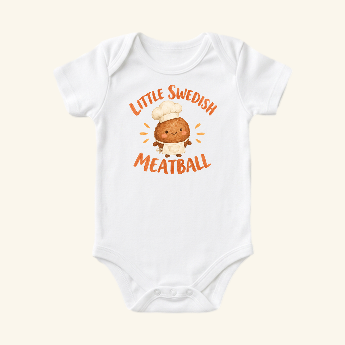 Toodleroos Little Swedish Meatball Baby Onesie – Cute Chef Bodysuit featuring a white baby onesie with a meatball illustration wearing a chef’s hat and apron, surrounded by the text Little Swedish Meatball.