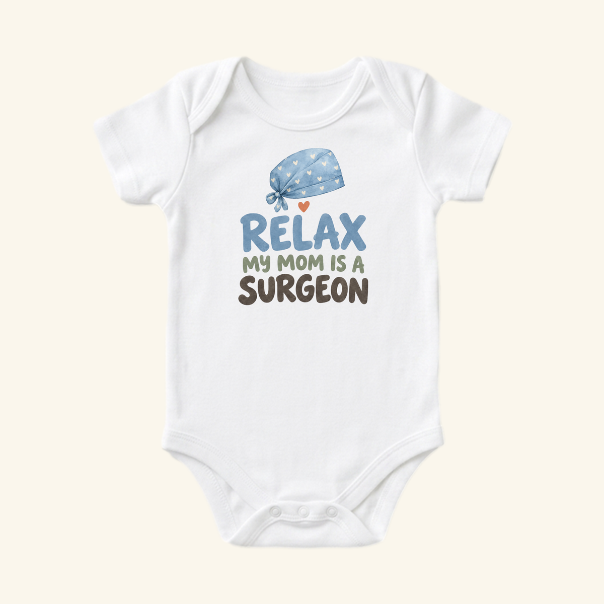 Toodleroos Surgeon Mom Baby Onesie – Relax My Mom Is a Surgeon Bodysuit featuring a white bodysuit with a light blue surgical cap illustration and the text Relax my mom is a surgeon.