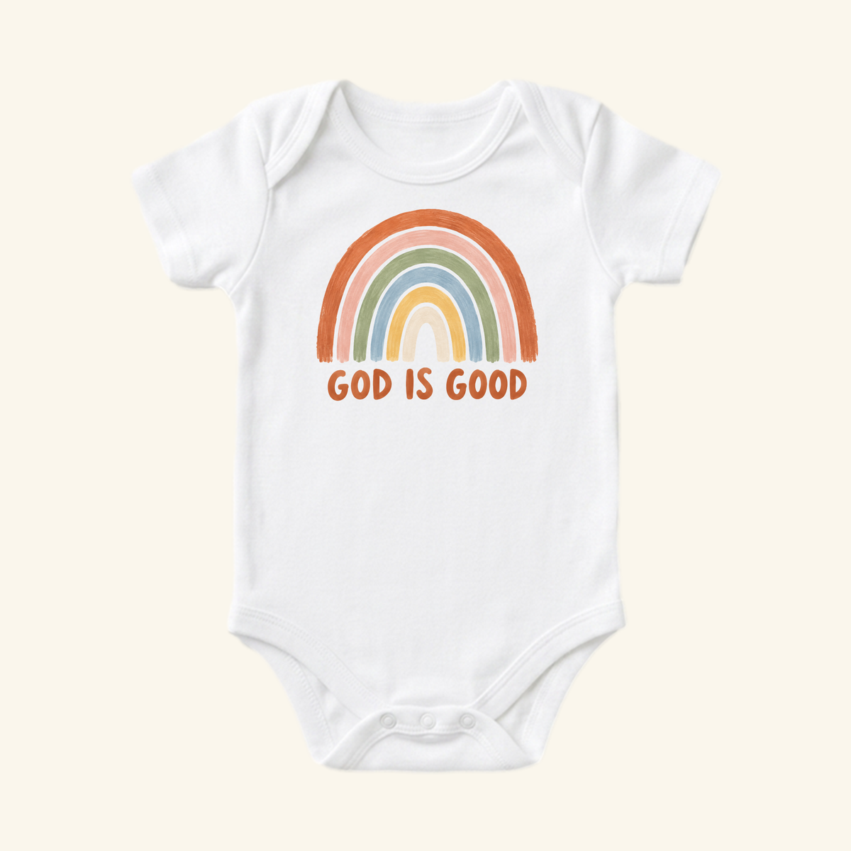 The Toodleroos Christian Baby Onesie – God Is Good Rainbow Bodysuit features a hand-drawn muted rainbow and bold GOD IS GOOD text—a sweet, thoughtful Christian baby gift.