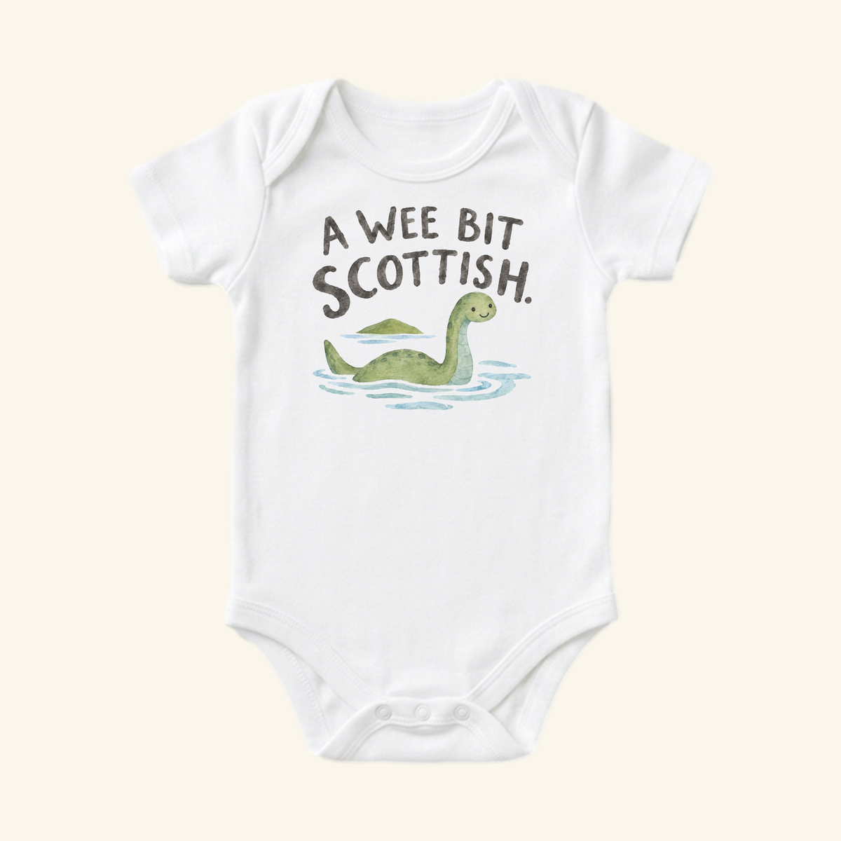 A white Toodleroos A Wee Bit Scottish Baby Onesie – Cute Loch Ness Monster Heritage Bodysuit featuring a watercolor illustration of the Loch Ness monster in water with the text A WEE BIT SCOTTISH. above it.