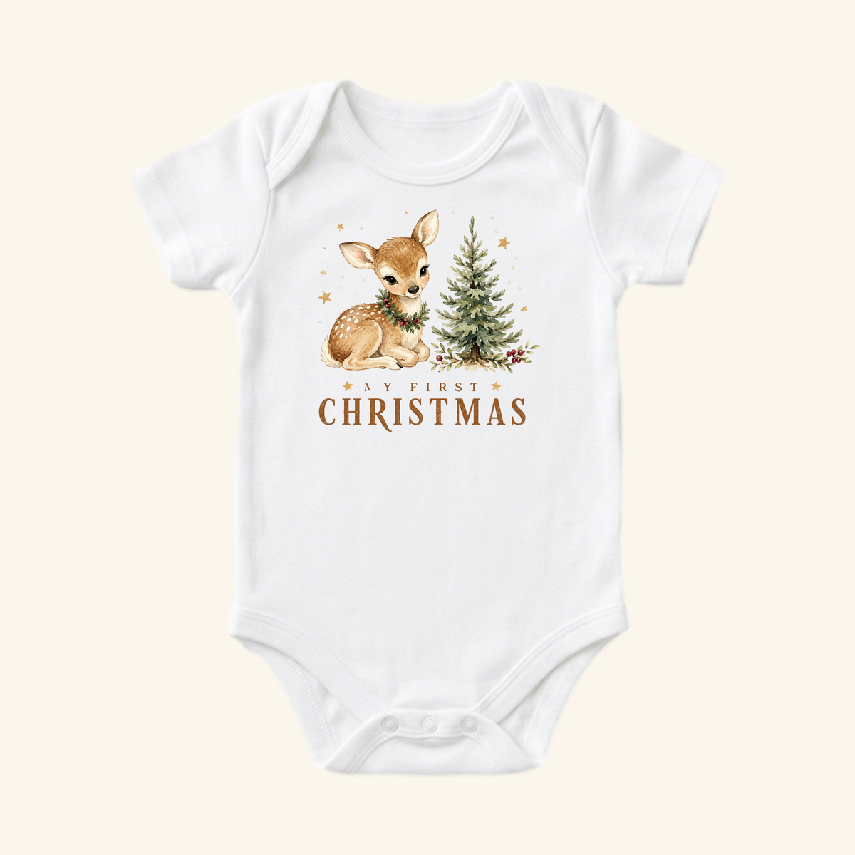 My First Christmas Baby Onesie – Woodland Fawn Bodysuit featuring a white baby bodysuit with a woodland fawn wearing a wreath next to a small Christmas tree, and the text My First Christmas underneath.
