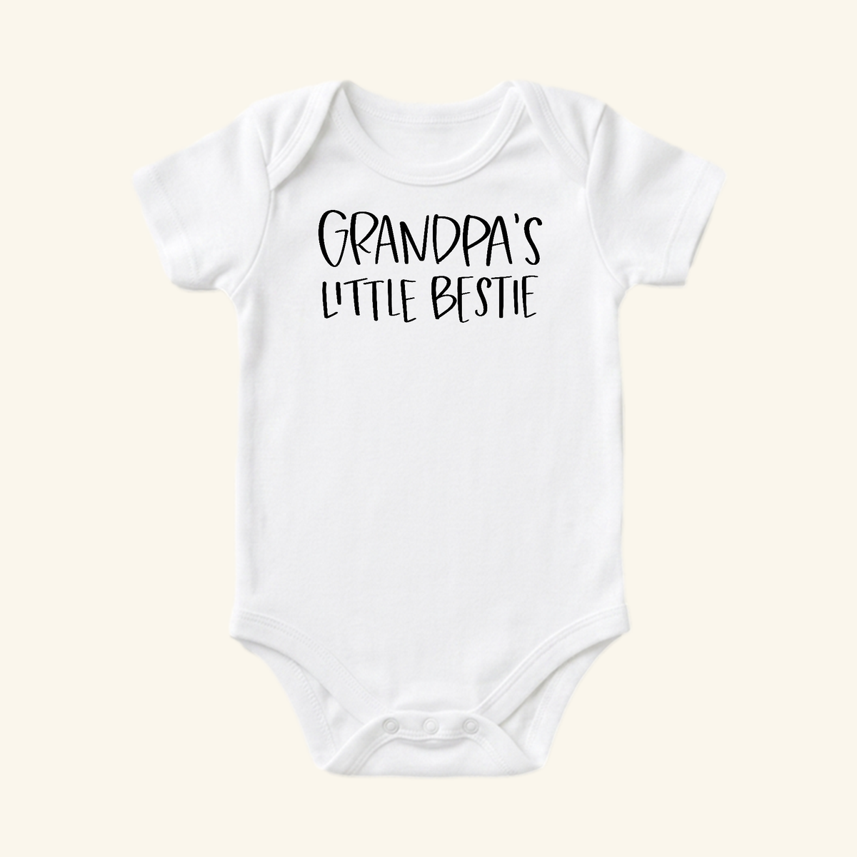 White Grandpa Baby Onesie – Grandpa’s Little Bestie Bodysuit with black text.