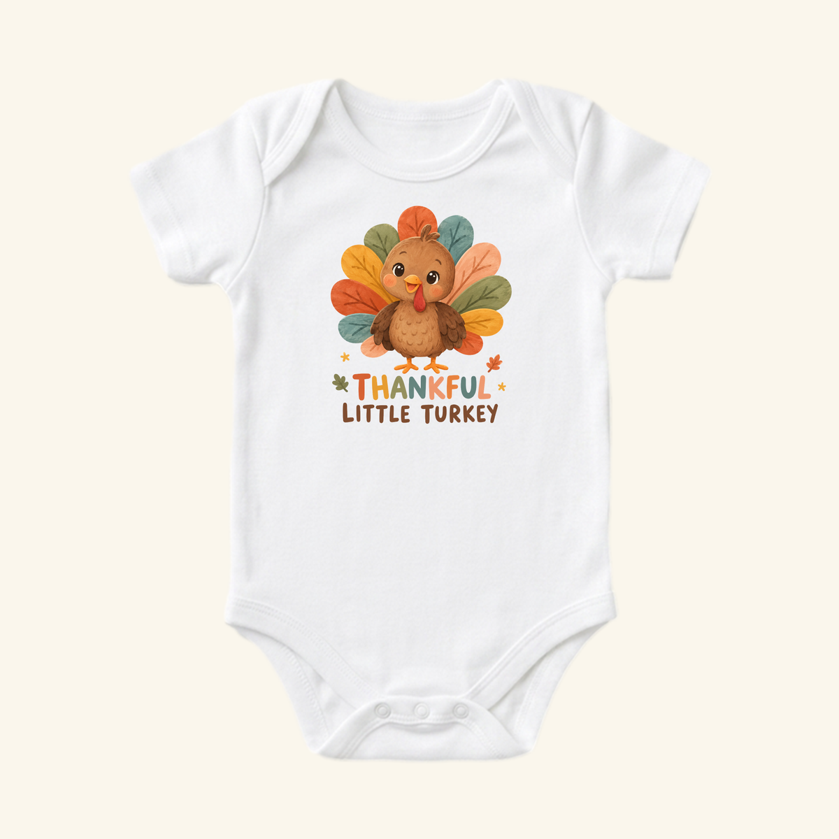 White Thankful Little Turkey Baby Onesie – Thanksgiving Bodysuit featuring a cartoon turkey with colorful feathers and the text THANKFUL LITTLE TURKEY.