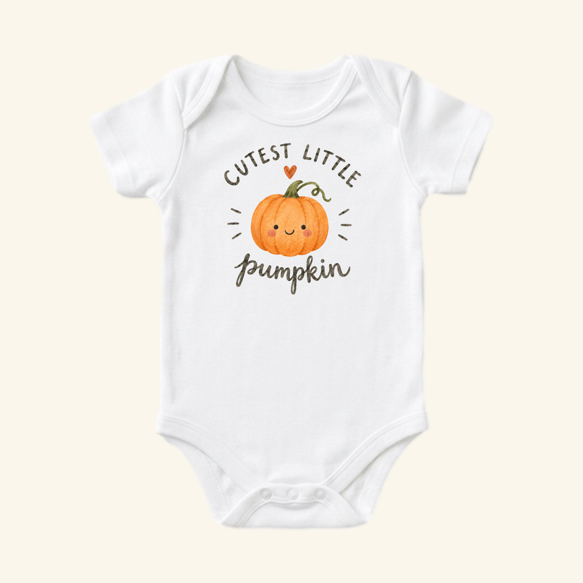 White Toodleroos Cutest Little Pumpkin Baby Onesie featuring a watercolor illustration of a smiling pumpkin and the text Cutest Little Pumpkin.