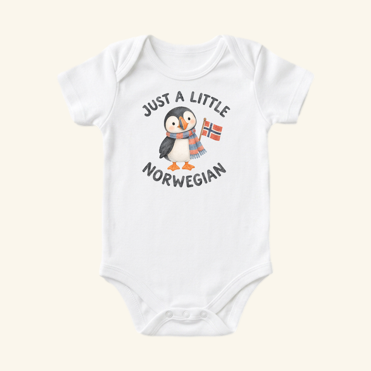 A Toodleroos Just a Little Norwegian Baby Onesie – Cute Puffin Norway Flag Bodysuit featuring a white bodysuit with a puffin in a scarf holding a Norwegian flag and the text Just a little Norwegian.