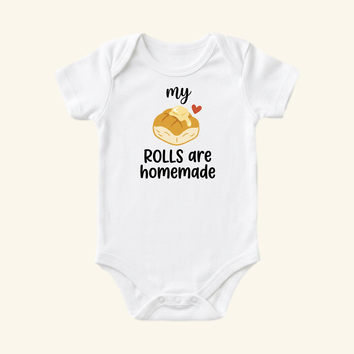 White My Rolls Are Homemade Baby Thanksgiving Onesie - Fall Bodysuit featuring an illustration of a buttered dinner roll and the text my ROLLS are homemade.