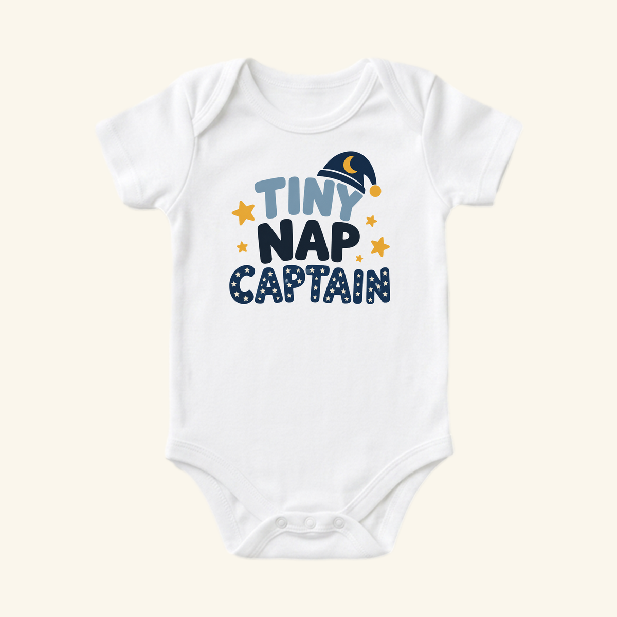 White Toodleroos Funny Baby Onesie – Tiny Nap Captain Sleepy Baby Bodysuit featuring Tiny Nap Captain text, a sleeping cap icon, and yellow stars.