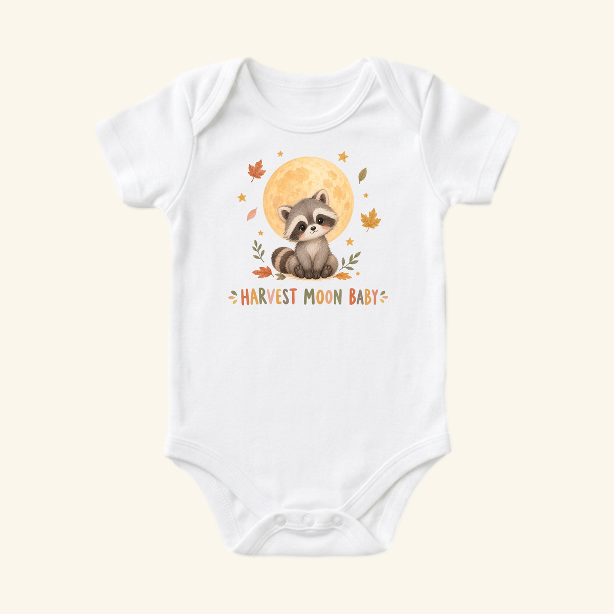 Toodleroos Harvest Moon Baby Onesie – Fall Raccoon Bodysuit in white featuring a raccoon sitting under a moon with fall leaves and the text HARVEST MOON BABY.