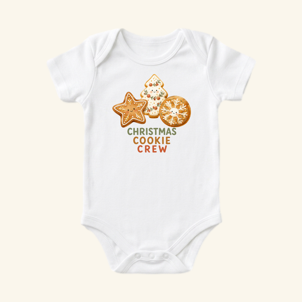 Toodleroos Christmas Cookie Crew Baby Onesie, a white bodysuit featuring a graphic of three smiling holiday cookies and the text CHRISTMAS COOKIE CREW.