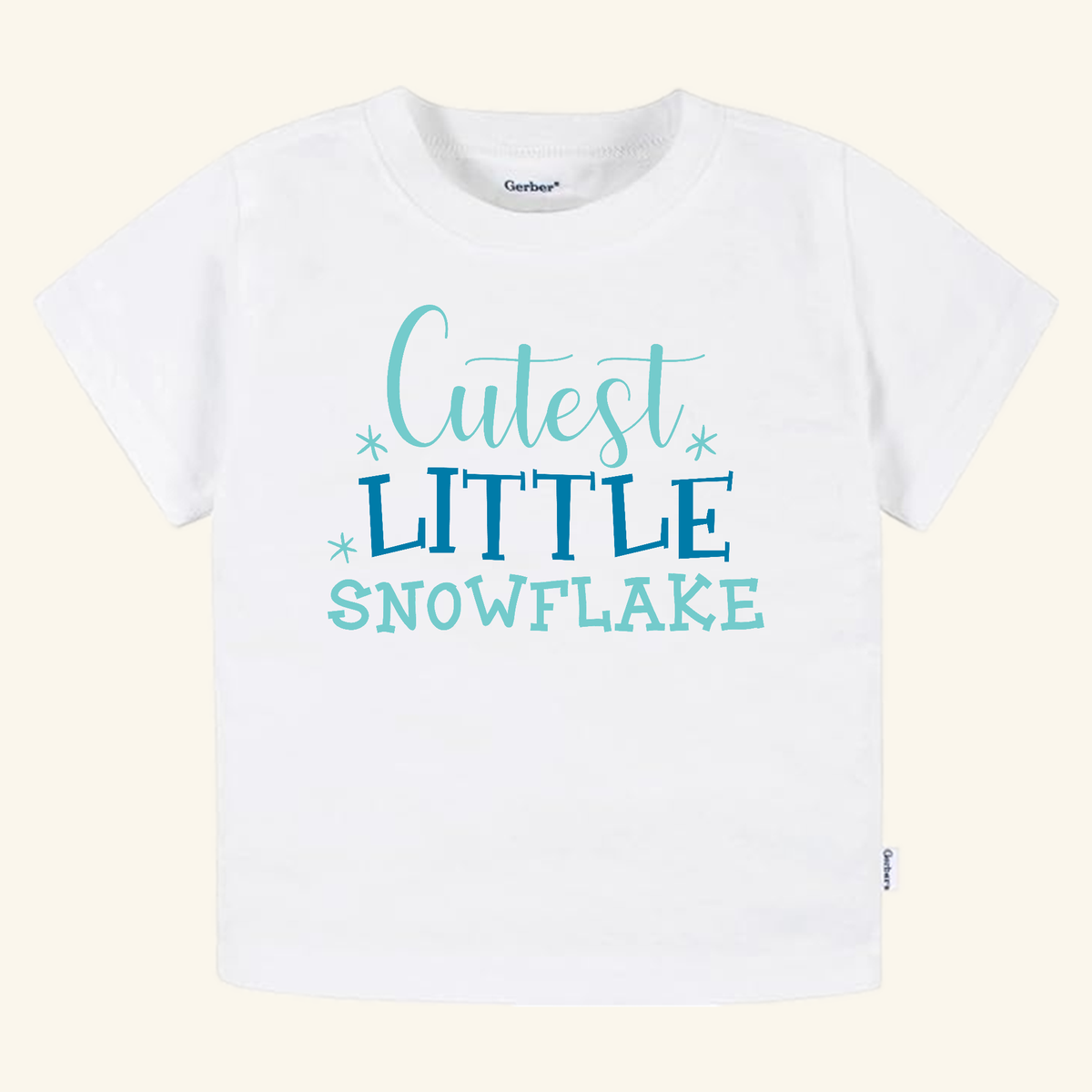 White short-sleeved Winter Toddler Shirt – Cutest Little Snowflake Tee featuring the text Cutest Little Snowflake in blue.