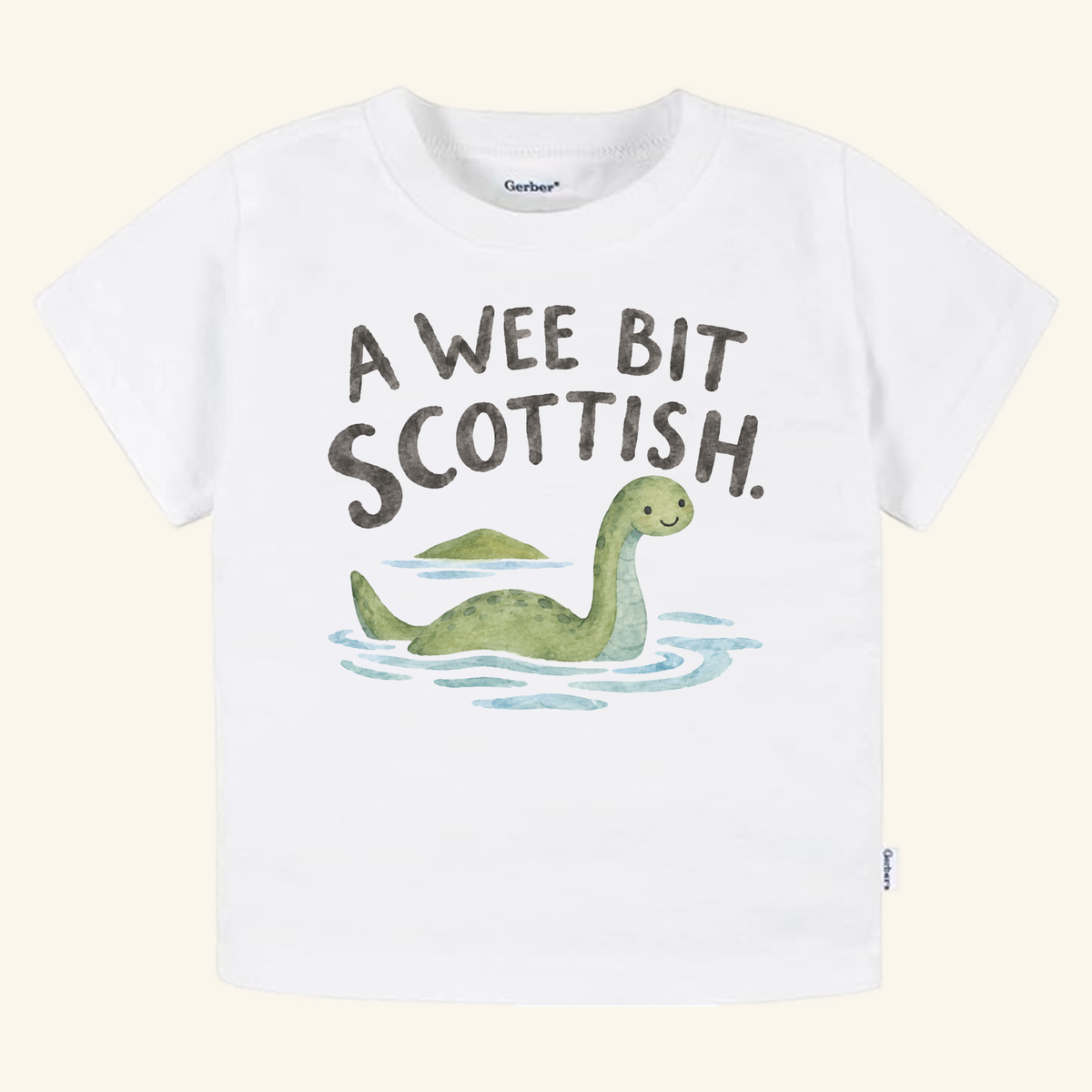 A Wee Bit Scottish Toddler Shirt, featuring a white toddler t-shirt with a watercolor illustration of the Loch Ness monster in water and the text A WEE BIT SCOTTISH.