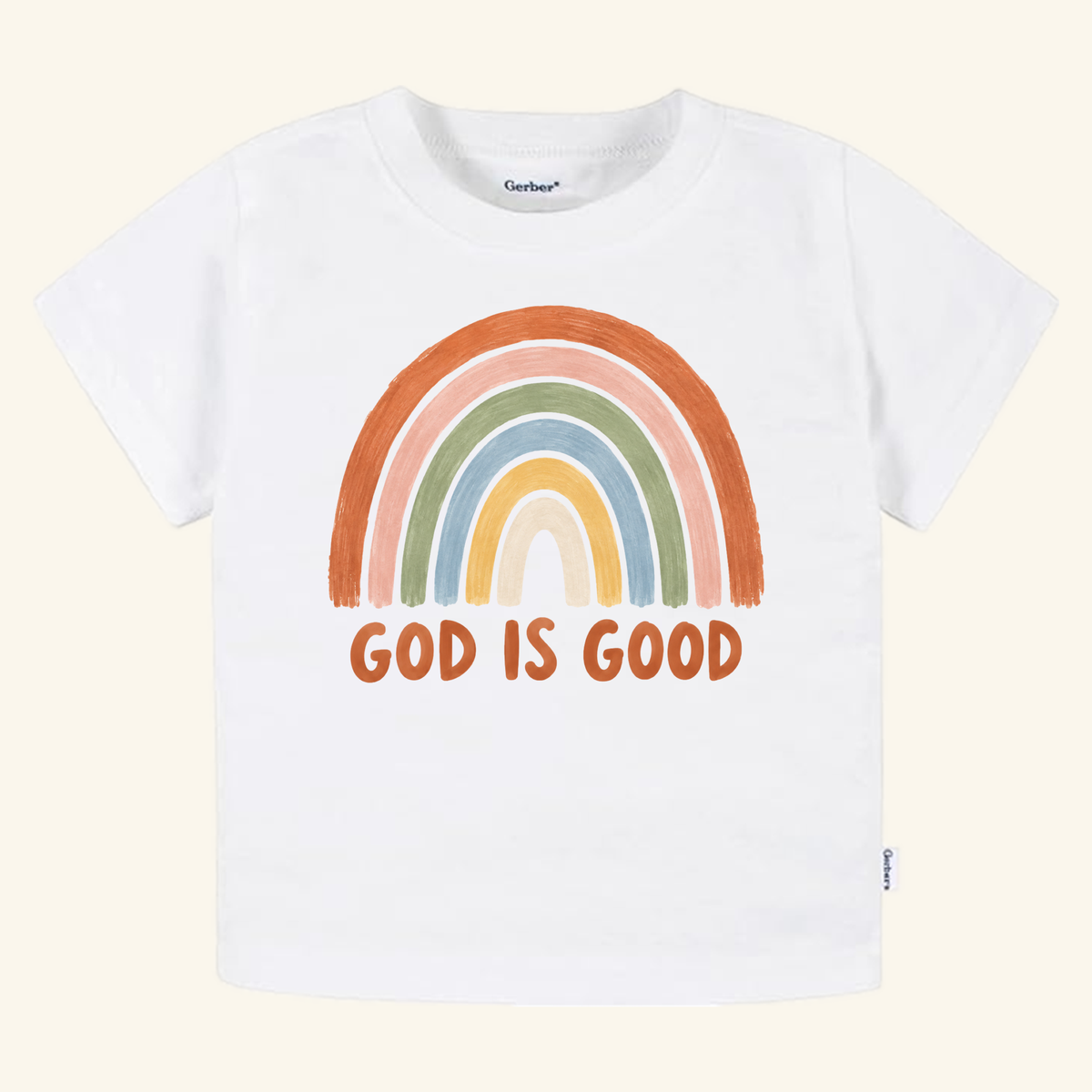 The Toodleroos Christian Toddler Shirt – God Is Good Rainbow Tee features a hand-drawn rainbow and uplifting message—perfect for little ones to share their faith.
